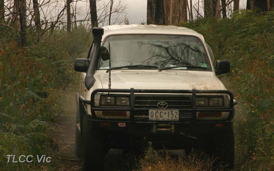 09-Grub makes dust approaching Mt Strickland summit.JPG